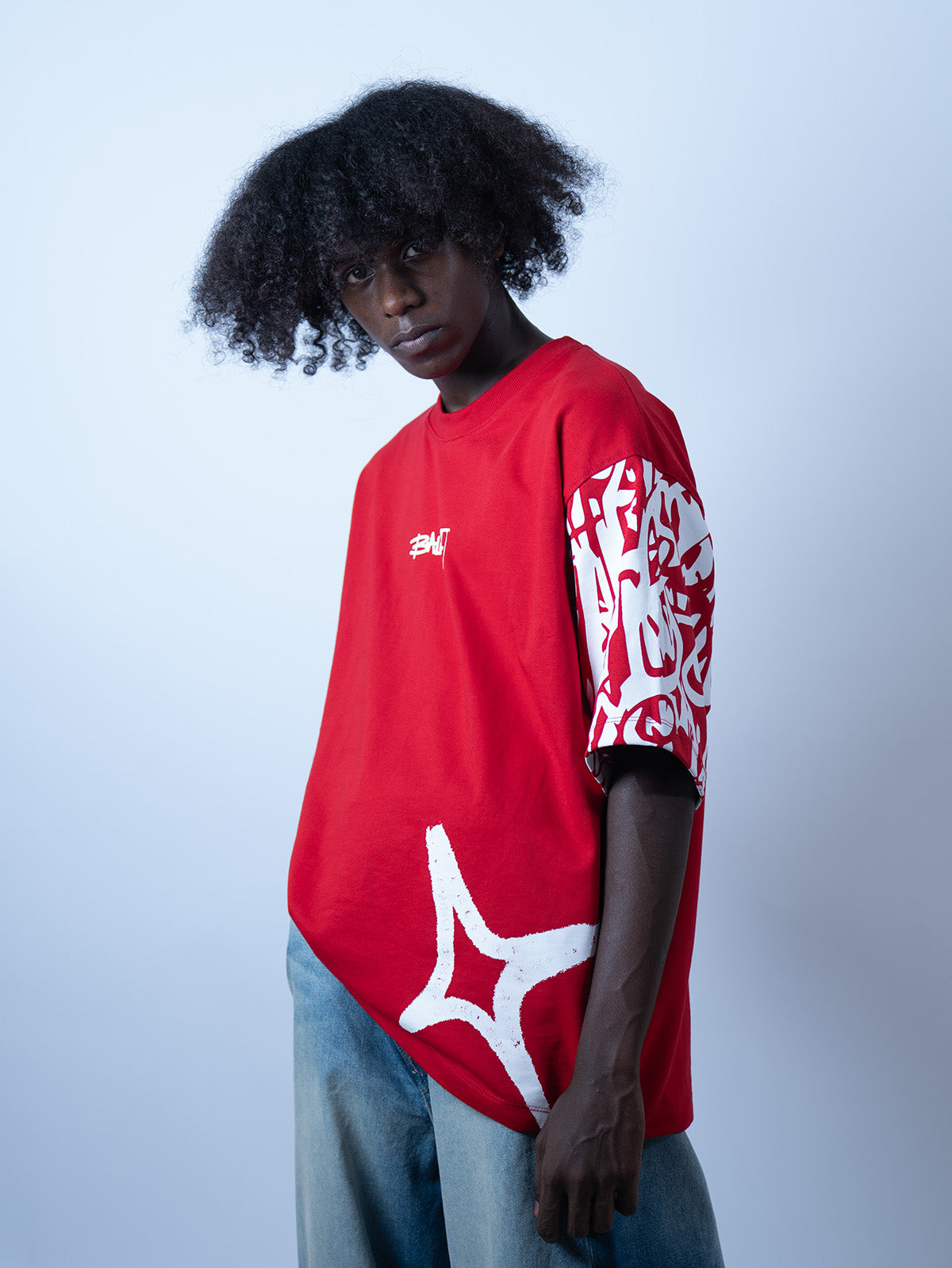 Front view image of a guy wearing Red graffi tee from Ballucci.